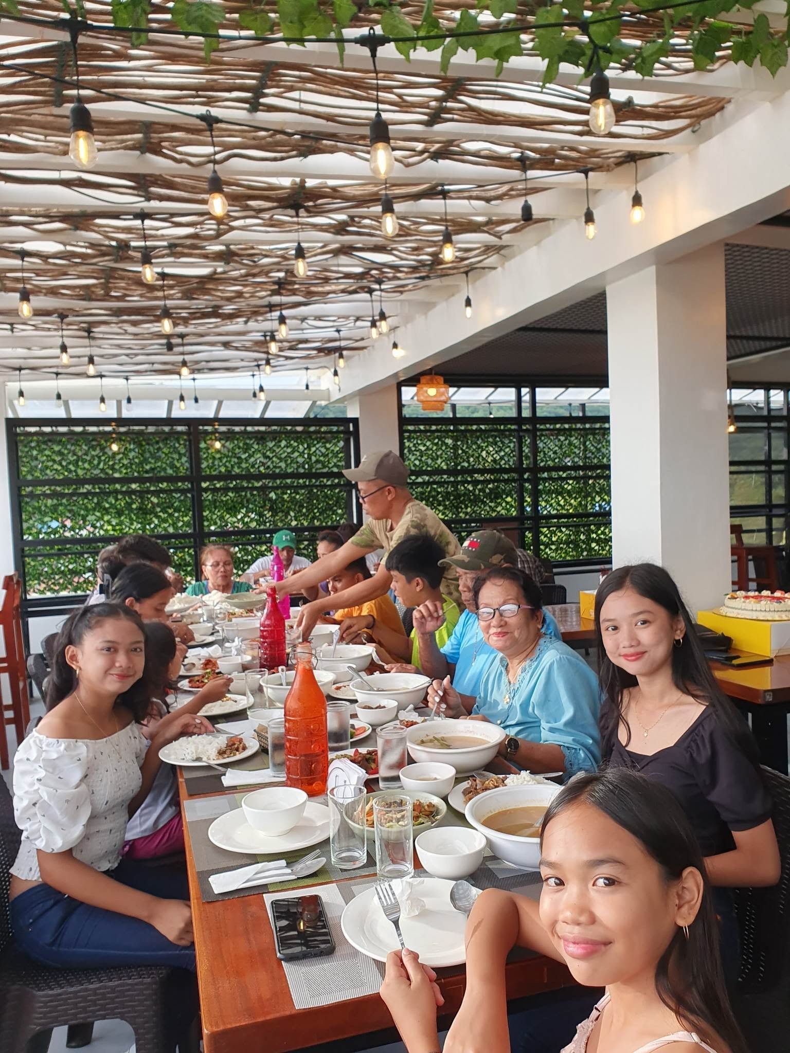 Guests gathered at a table at Café Hugo